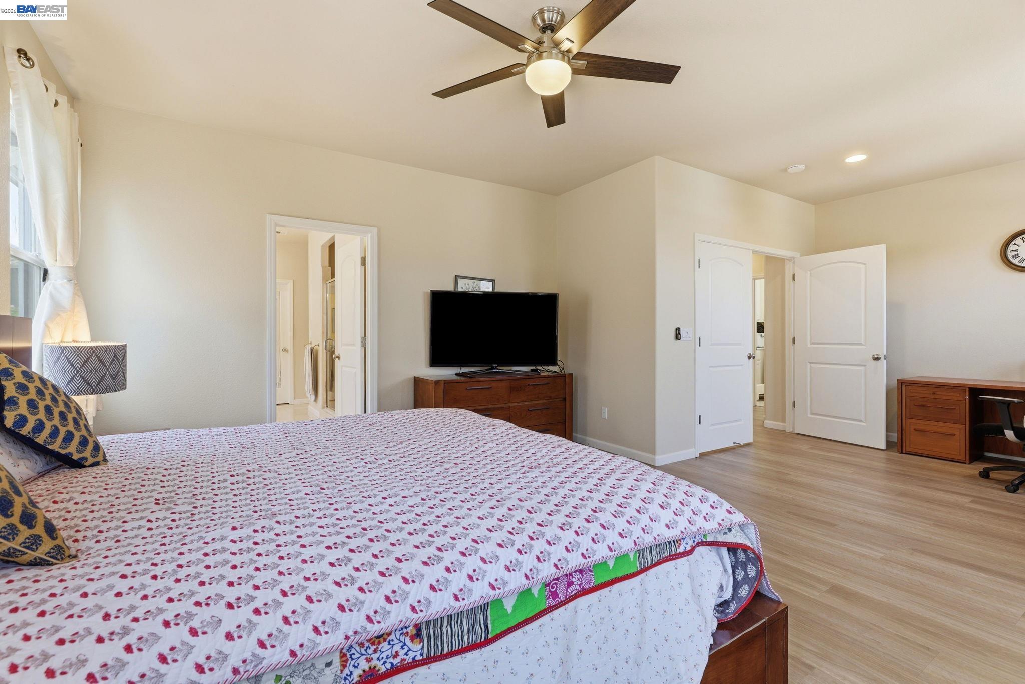 5029 Queensbury Way San Ramon, CA 94582 - Photo 20 of 58 a bedroom with a bed and a flat screen tv