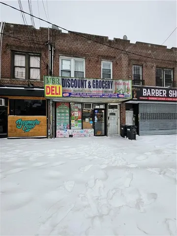 a view of a cafe with sitting area
