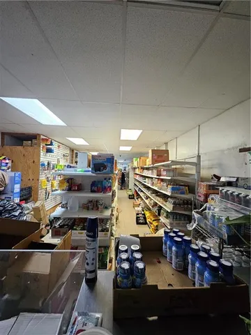 a kitchen with lots of clutter and lots of appliances