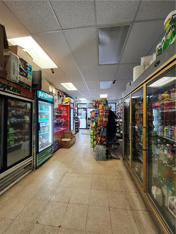 a view of a garage with rack and a ceiling fan