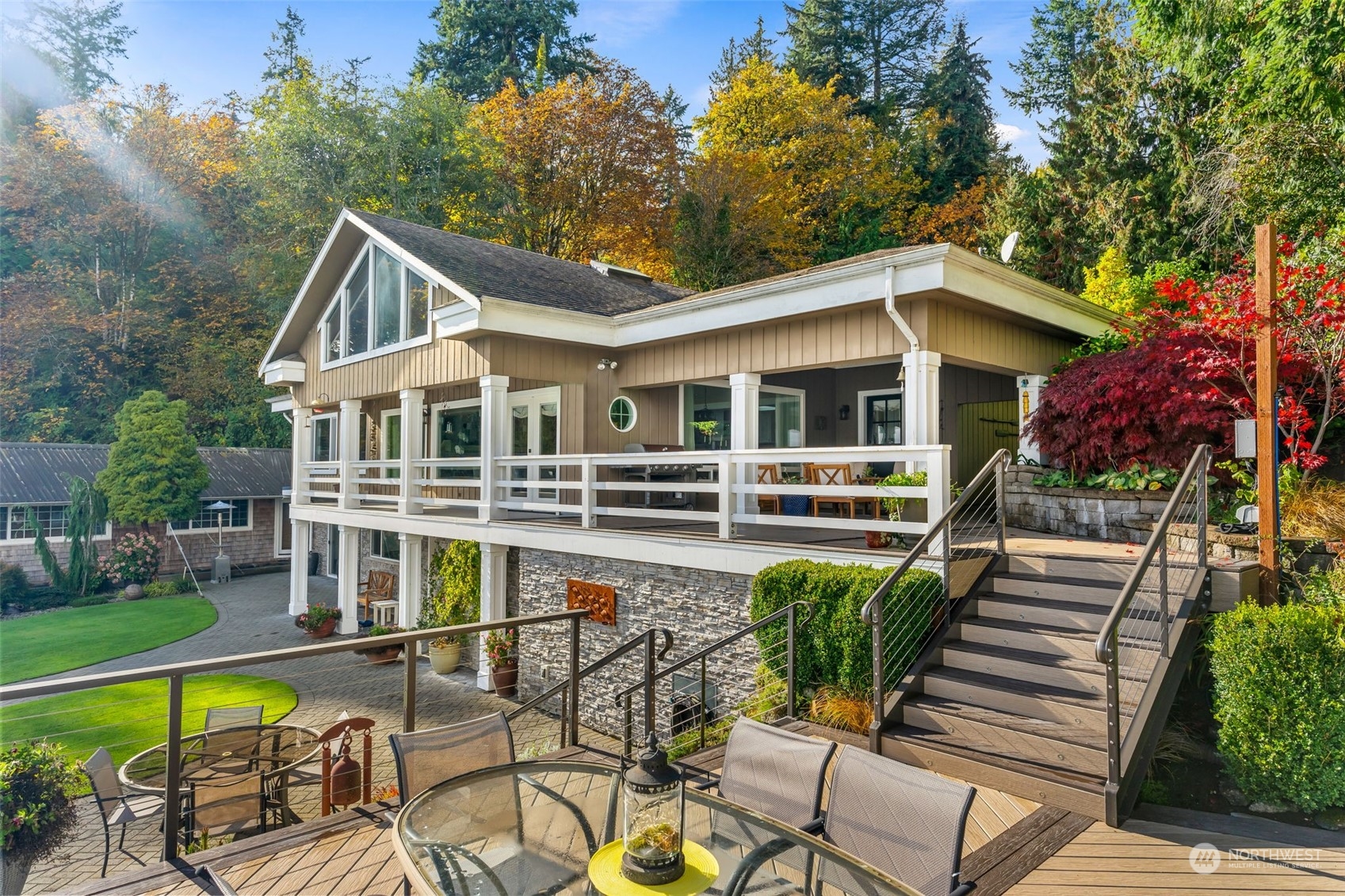 4154 Cooper Point Road Northwest Olympia, WA 98502 - Photo 2 of 40 a view of a house with pool and chairs