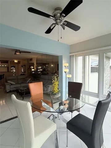 a view of a livingroom with furniture and a window