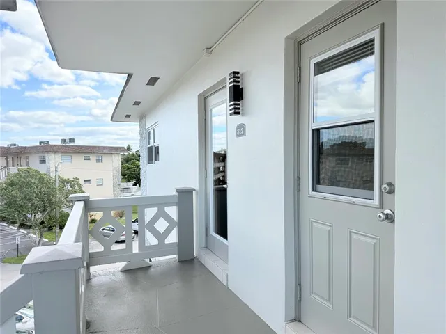 a view of a livingroom with furniture and windows