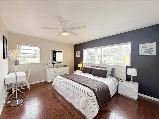 a bedroom with a bed and a chair