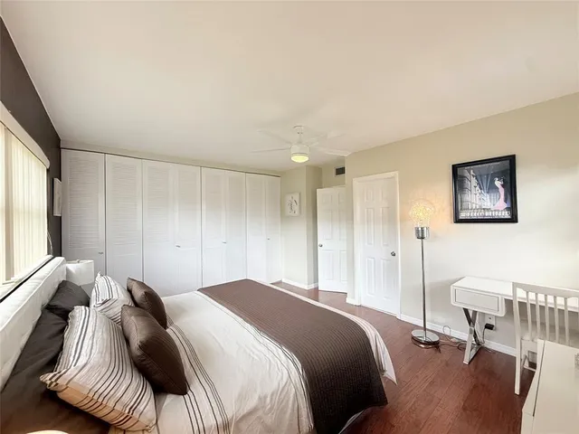 a bedroom with a bed and a chair