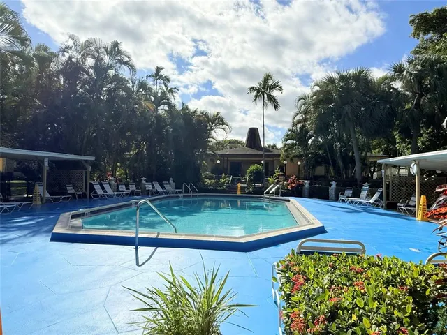 a view of a swimming pool with a patio
