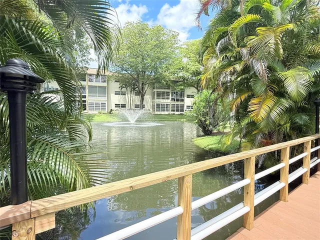a view of a park with sitting area