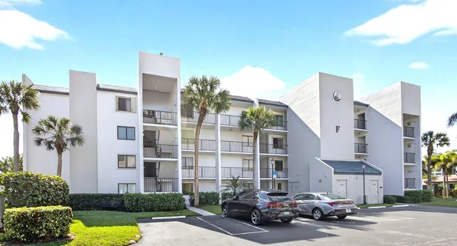 a car parked in front of a brick building