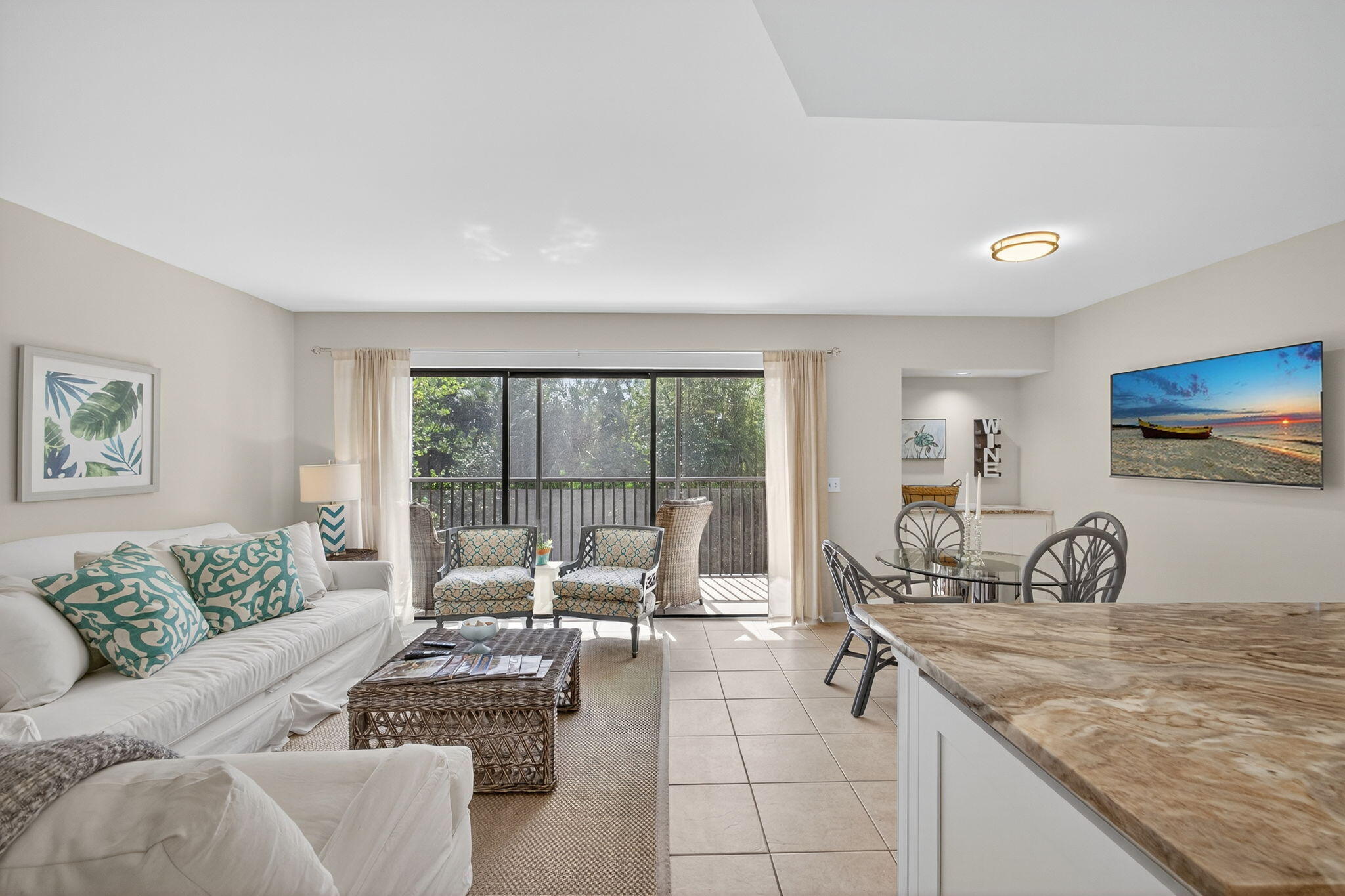 1605 Highway 1, Unit F204 Jupiter, FL 33477 - Photo 15 of 51 a living room with furniture and a flat screen tv