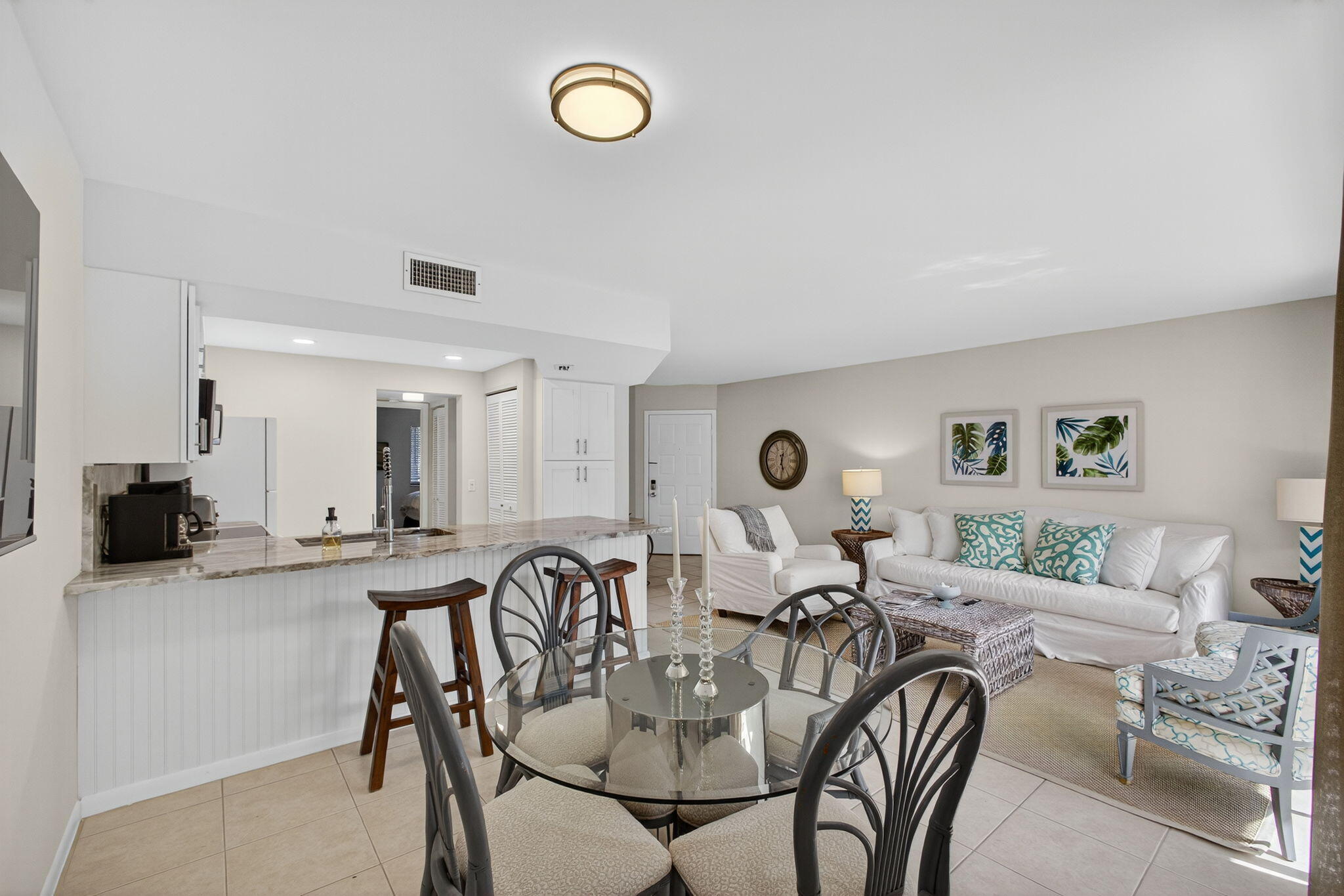 1605 Highway 1, Unit F204 Jupiter, FL 33477 - Photo 20 of 51 a living room with lots of furniture and view of kitchen