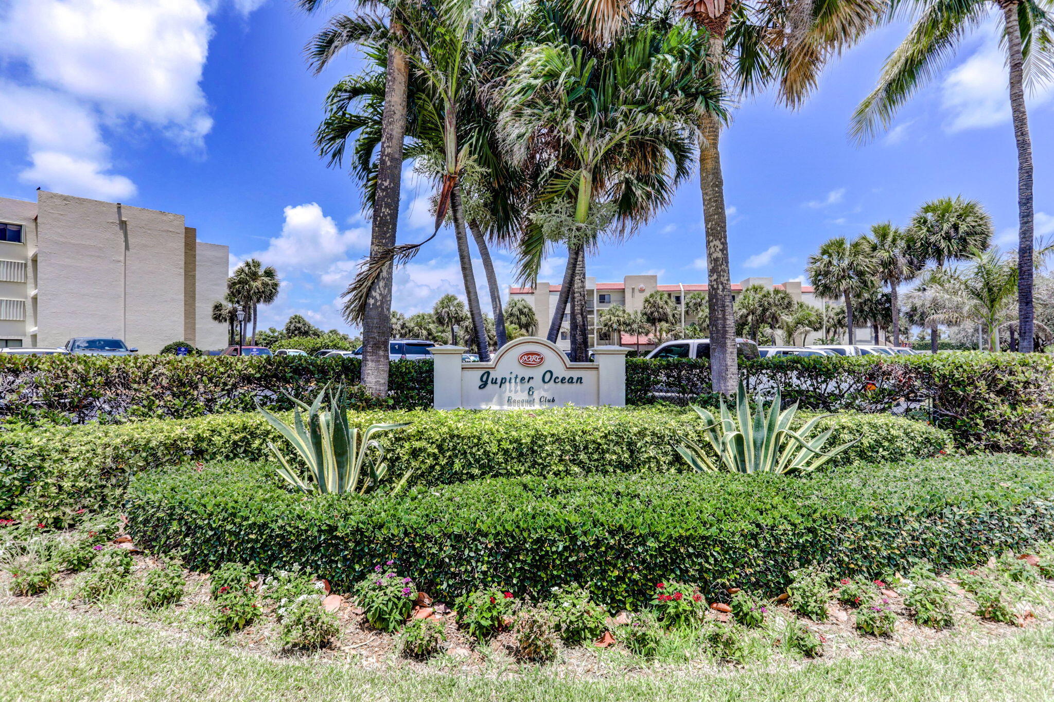 1605 Highway 1, Unit F204 Jupiter, FL 33477 - Photo 2 of 51 a view of a palm trees front of house