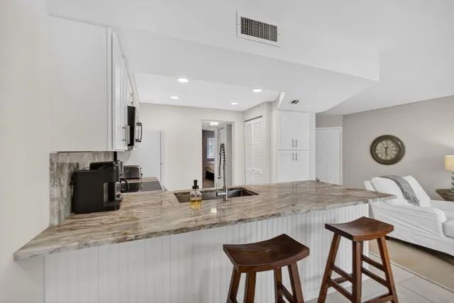 a kitchen with a table and chairs in it