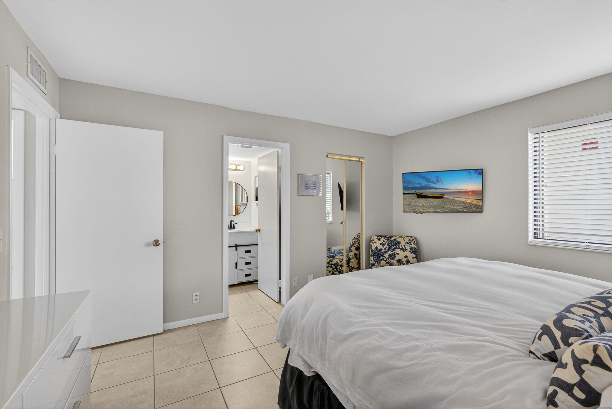 1605 Highway 1, Unit F204 Jupiter, FL 33477 - Photo 28 of 51 a bedroom with a bed and a window