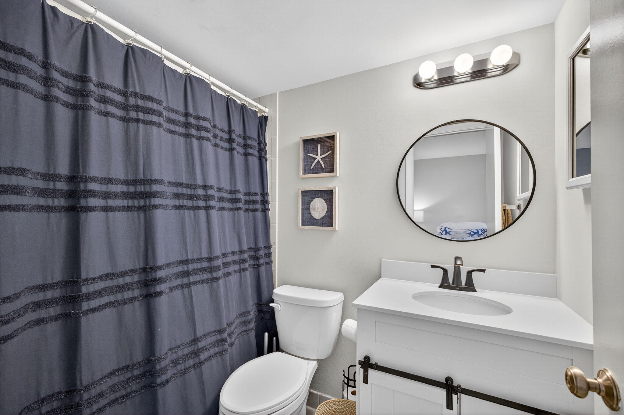 1605 Highway 1, Unit F204 Jupiter, FL 33477 - Photo 31 of 51 a bathroom with a toilet a sink and mirror