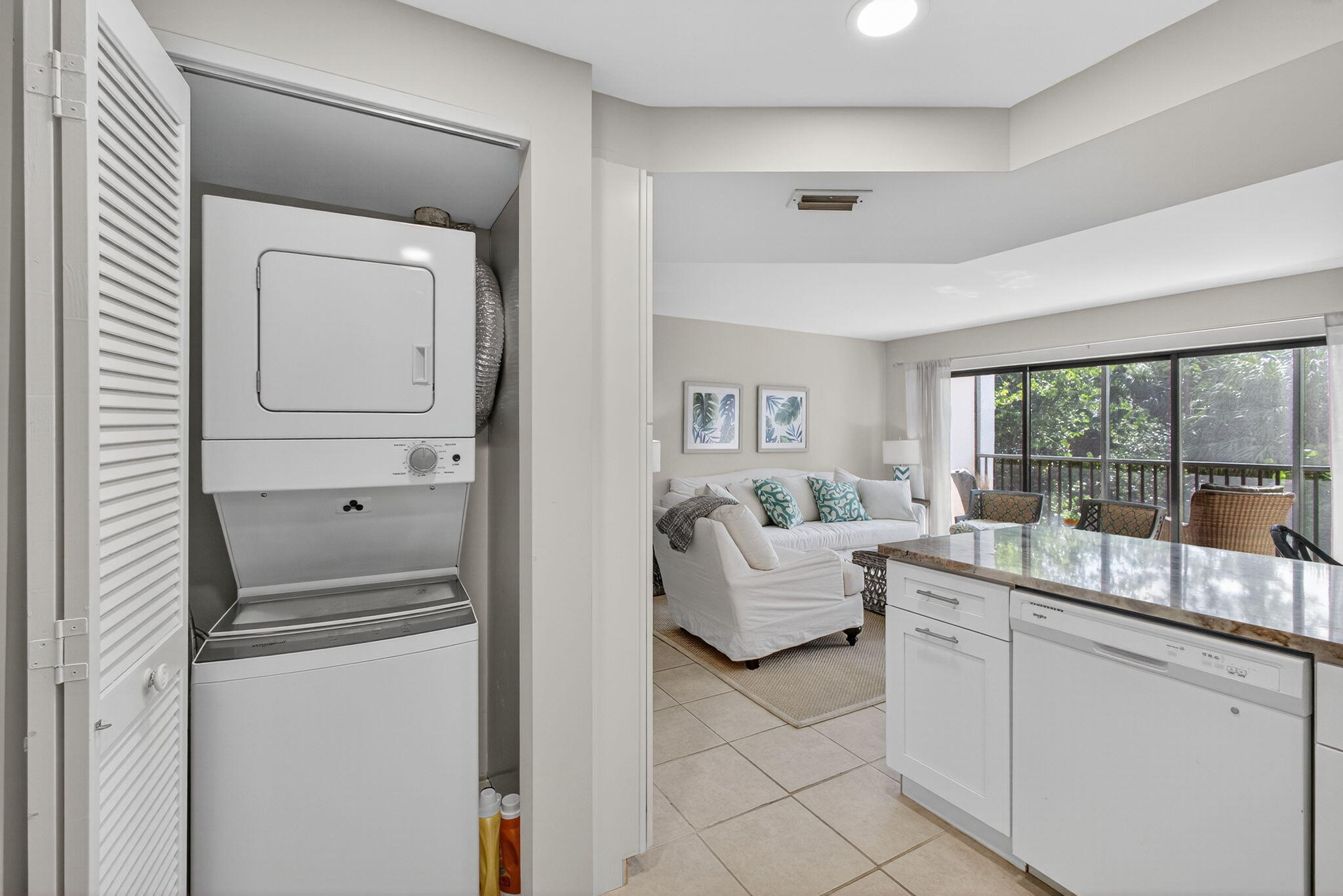 1605 Highway 1, Unit F204 Jupiter, FL 33477 - Photo 32 of 51 a room with a couch and a window