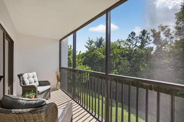 a view of a balcony with furniture