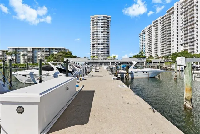 a view of roof deck with large pool and ocean view