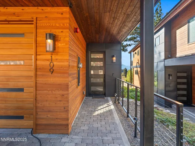 a view of a wooden door of the house