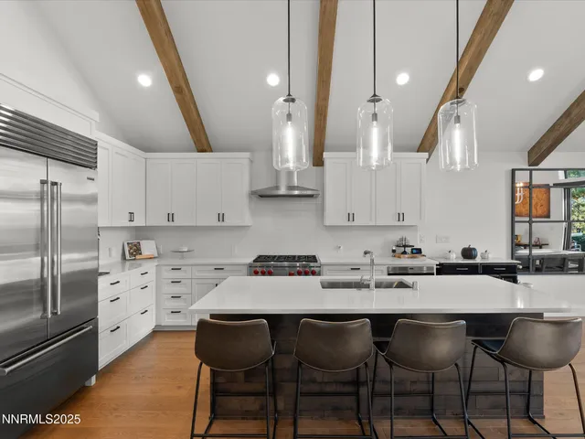 a kitchen with a sink stove and refrigerator