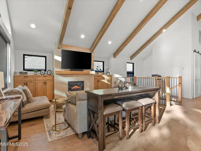 a living room with furniture and a rug