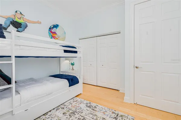 a kitchen with a table chairs refrigerator and cabinets