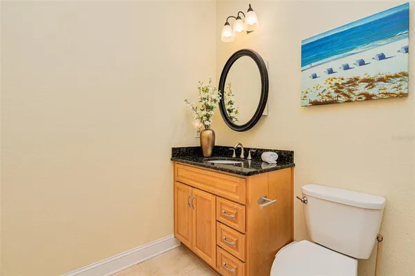 a kitchen with refrigerator cabinets and wooden floor