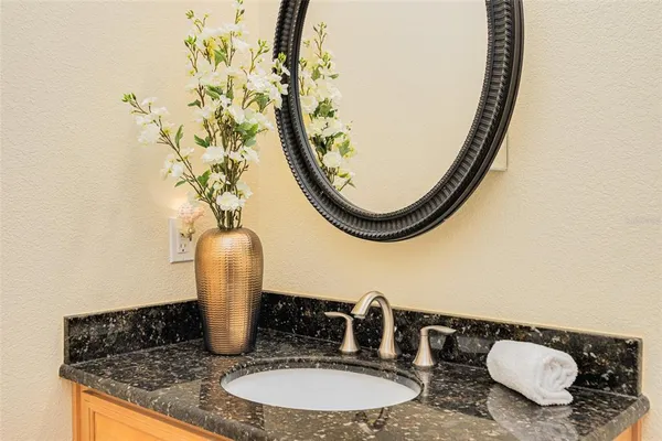 a room with pool table and windows