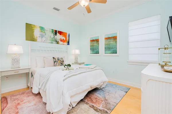 a room with pool table and a ceiling fan