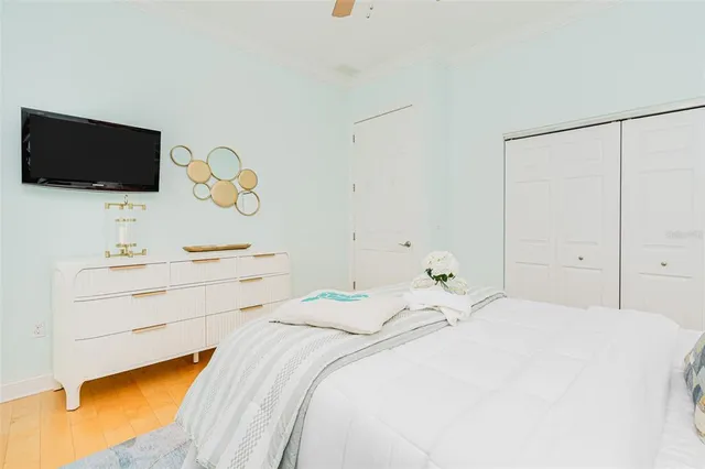 a room with pool table and a ceiling fan