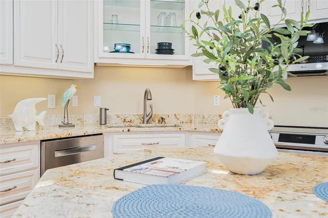 a spacious bedroom with a large bed and a flat screen tv