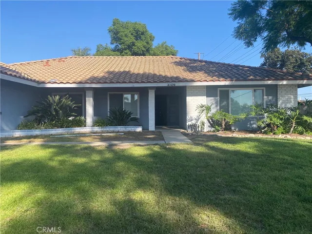 a view of a house with a garden