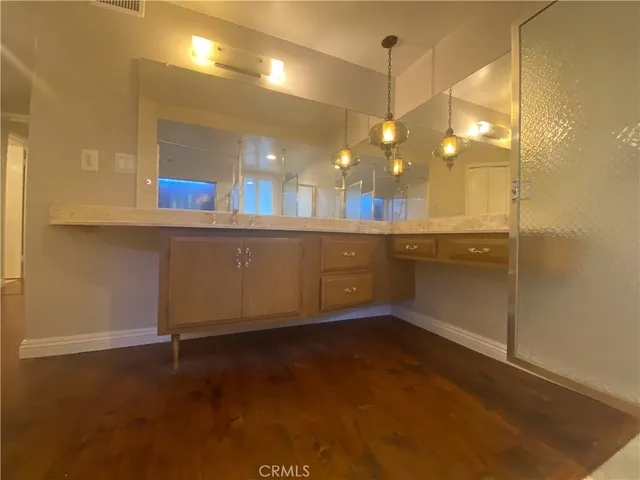 a view of a bathroom with a sink and mirror