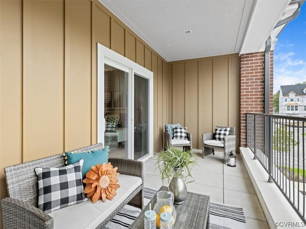 1504 Ewing Park Loop, Unit 202 Midlothian, VA 23113 - Photo 19 of 26 a living room with furniture and a window