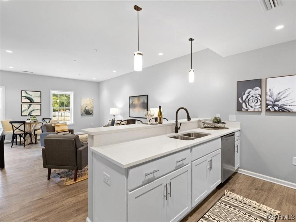 1504 Ewing Park Loop, Unit 202 Midlothian, VA 23113 - Photo 5 of 26 a view of center island with granite countertop furniture and a sink