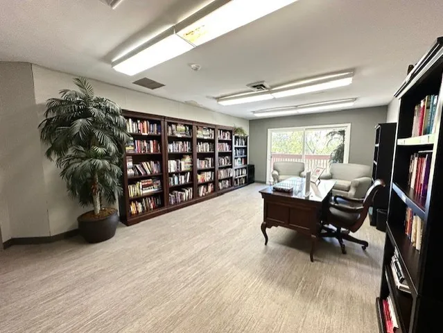 a view of swimming pool with outdoor seating