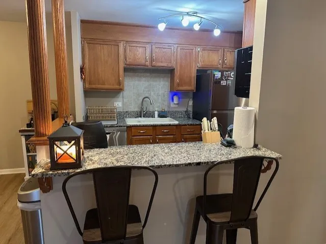 a dining table with chairs and cabinets