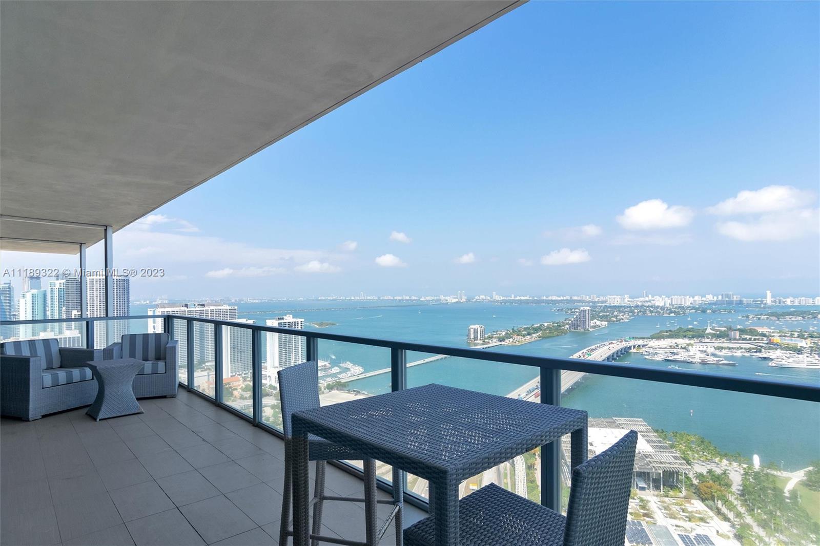 1100 Biscayne Boulevard, Unit 4204 Miami, FL 33132 - Photo 22 of 30 a terrace with outdoor seating and city view