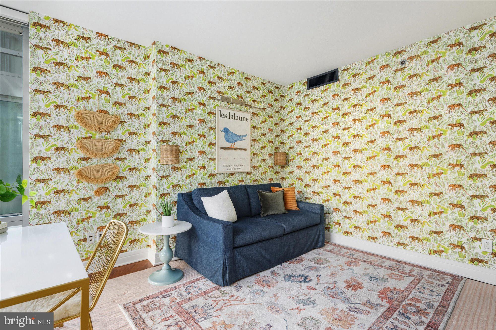 1155 23rd Street Northwest, Unit 8H Washington, DC 20037 - Photo 11 of 22 a living room with a couch and a rug