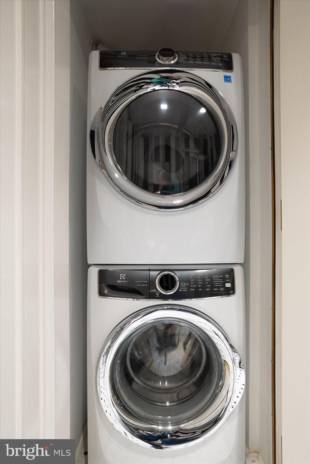 1155 23rd Street Northwest, Unit 8H Washington, DC 20037 - Photo 16 of 22 a utility room with dryer and washer