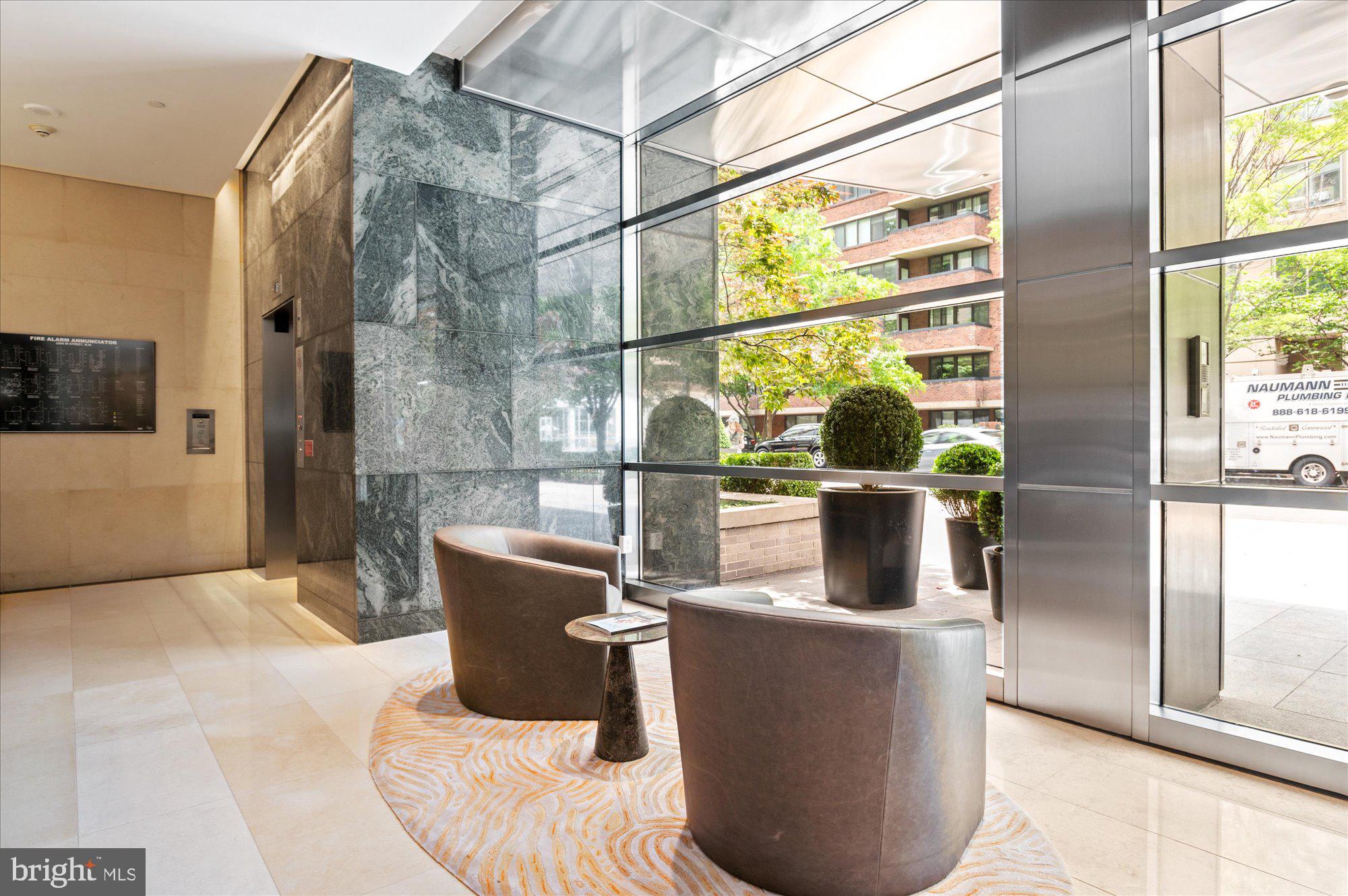 1155 23rd Street Northwest, Unit 8H Washington, DC 20037 - Photo 19 of 22 a living room with a couch and a large window