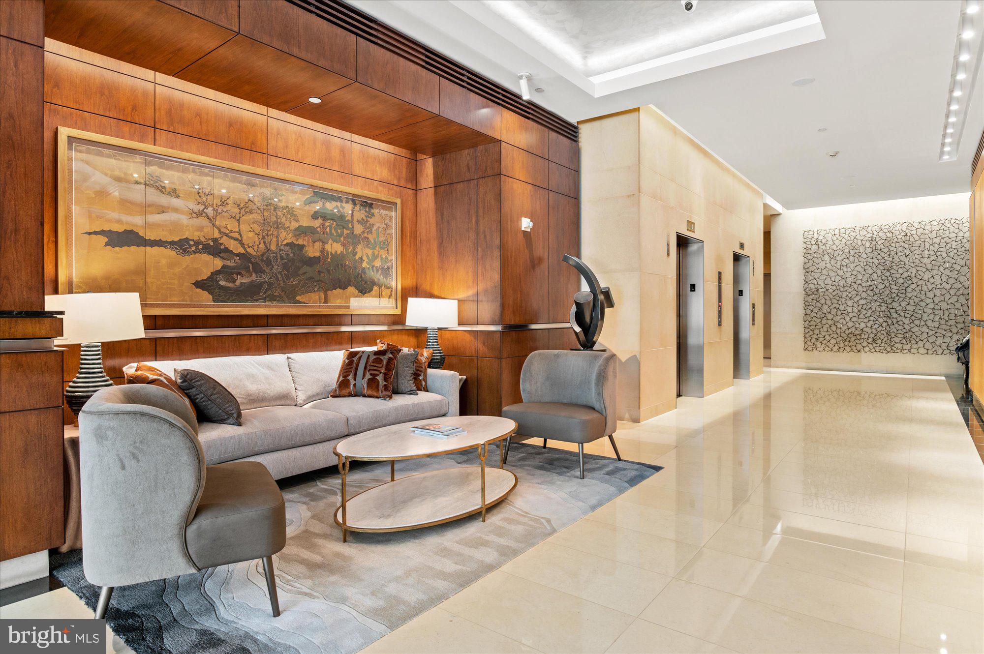 1155 23rd Street Northwest, Unit 8H Washington, DC 20037 - Photo 20 of 22 a living room with furniture and a large window