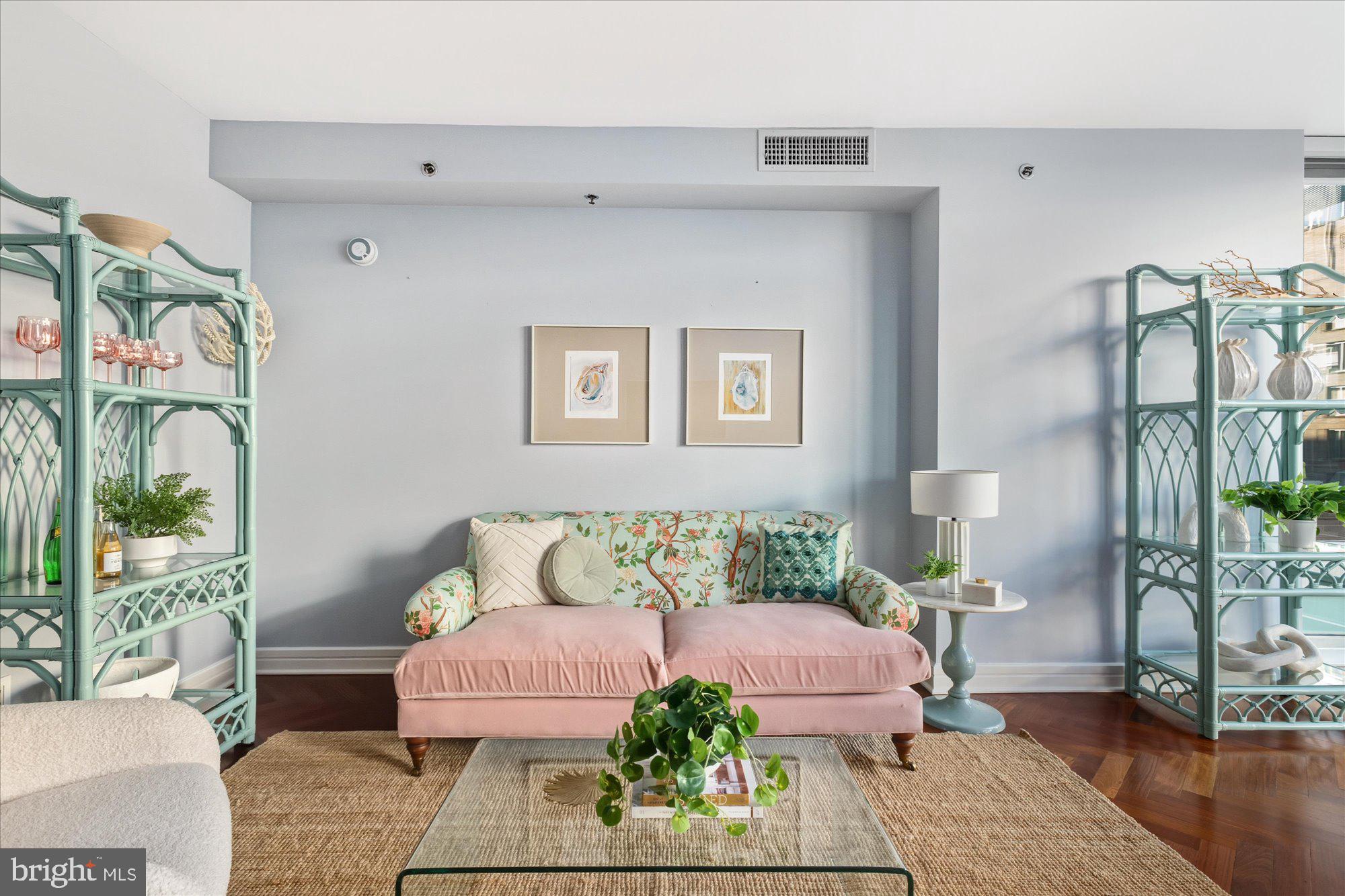 1155 23rd Street Northwest, Unit 8H Washington, DC 20037 - Photo 2 of 22 a bedroom with furniture and a couch