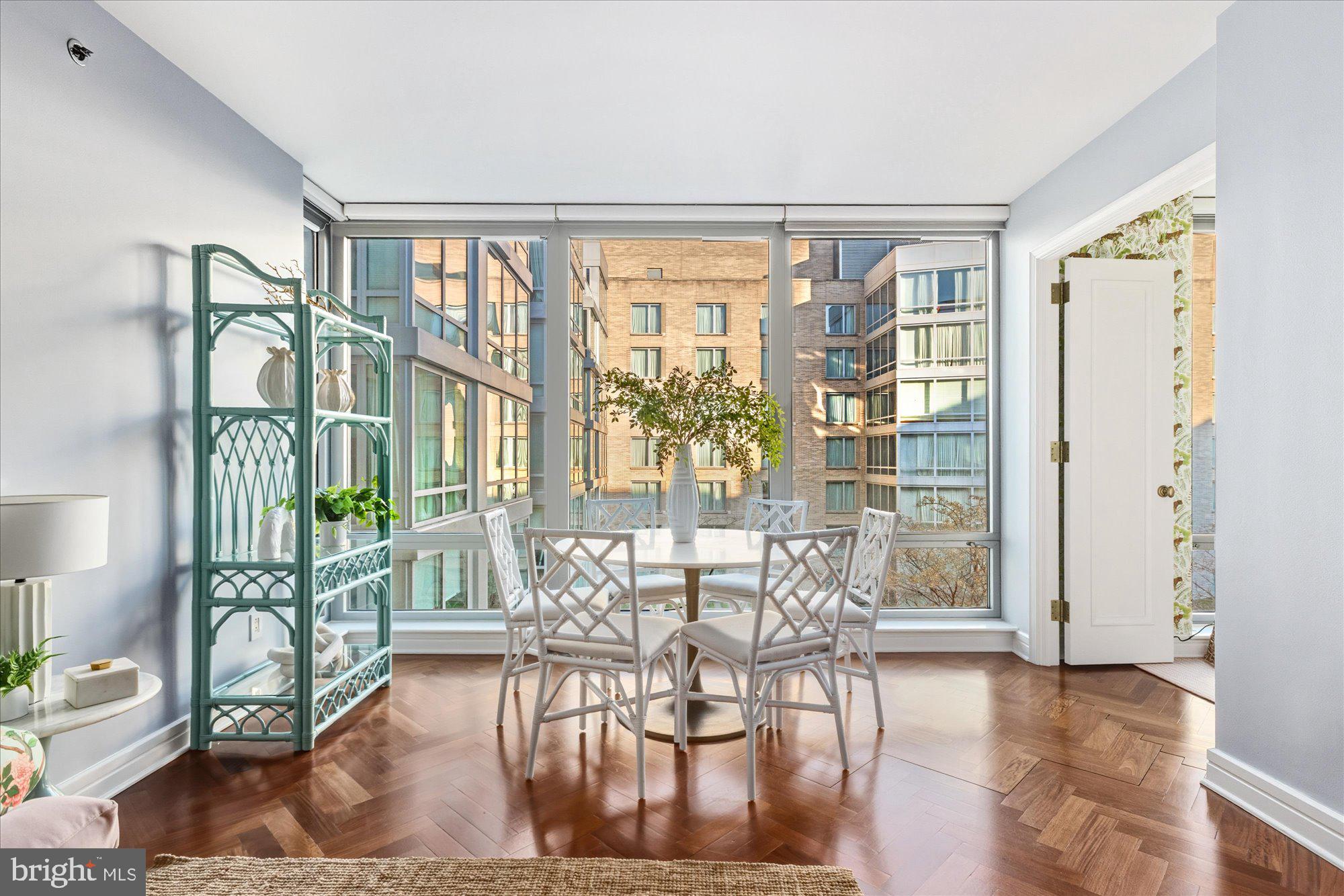 1155 23rd Street Northwest, Unit 8H Washington, DC 20037 - Photo 4 of 22 a view of a dining room with furniture window and outside view