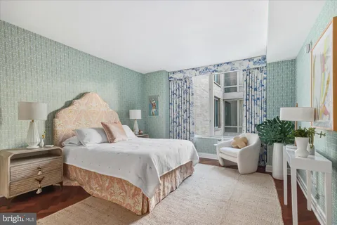 a spacious bedroom with a bed and a couch