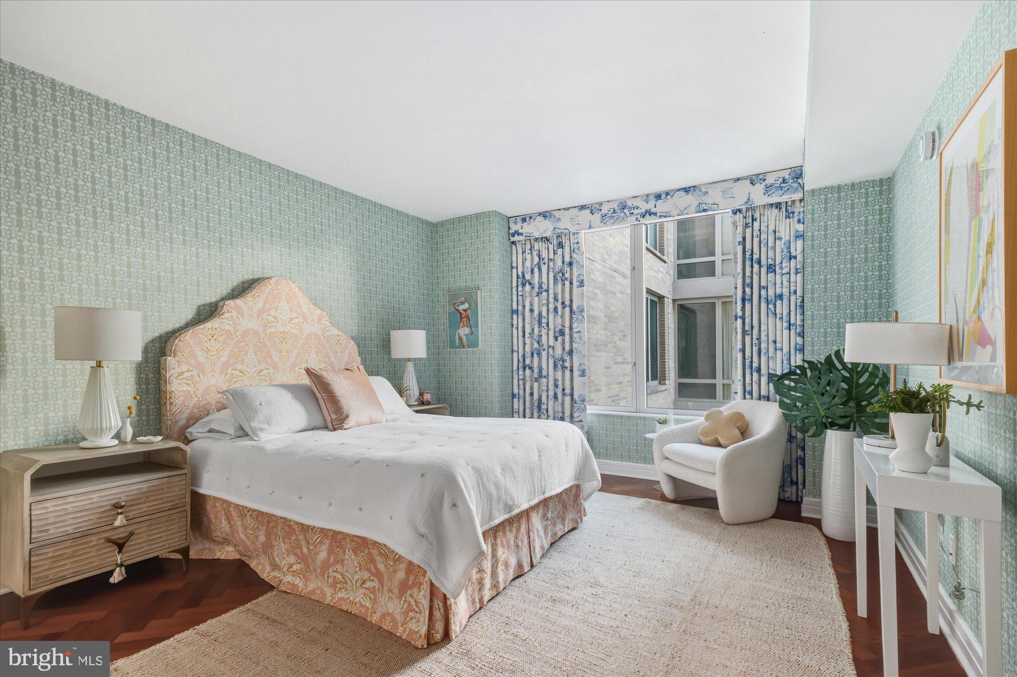 1155 23rd Street Northwest, Unit 8H Washington, DC 20037 - Photo 8 of 22 a spacious bedroom with a bed and a couch