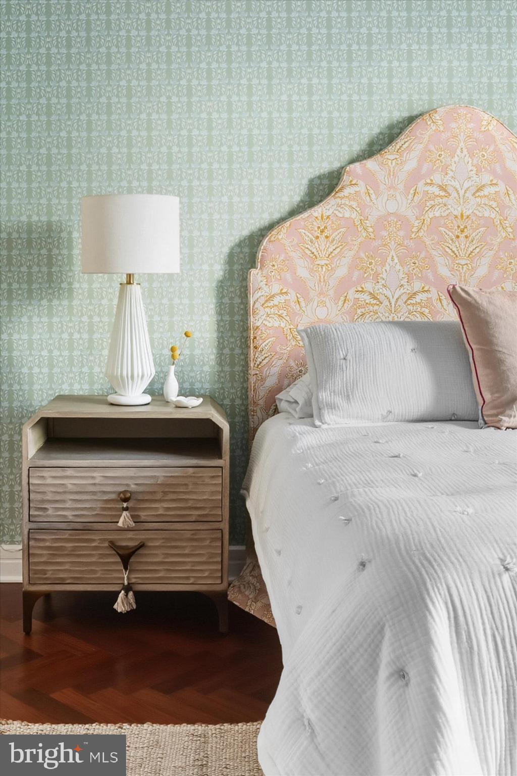 1155 23rd Street Northwest, Unit 8H Washington, DC 20037 - Photo 9 of 22 a bedroom with a bed and a lamp