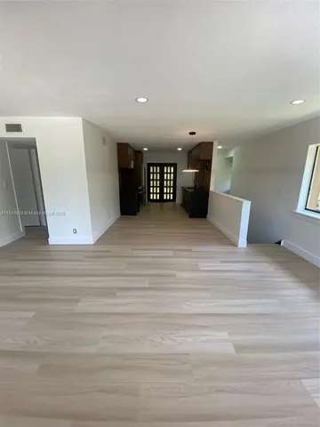 a view of a livingroom with furniture and cabinet