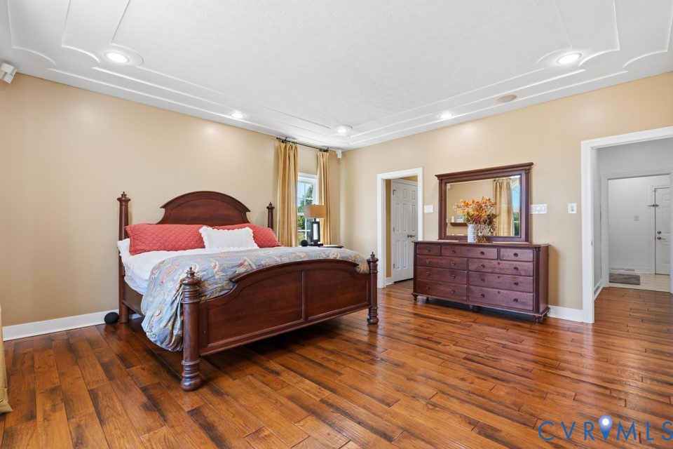7191 Figuly Road Mechanicsville, VA 23111 - Photo 17 of 46 a bedroom with a bed and wooden floor
