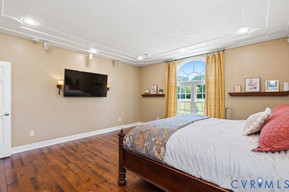 7191 Figuly Road Mechanicsville, VA 23111 - Photo 18 of 46 a bedroom with a bed and a flat screen tv