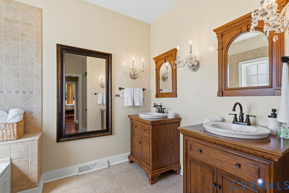 7191 Figuly Road Mechanicsville, VA 23111 - Photo 20 of 46 a bathroom with a sink vanity and mirror